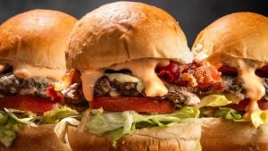 burgers with toppings and oozing sauce